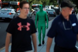 Colin Best who poses as an alien is spotted on his walk toward the White House in Washington, D.C. on July 24, 2013.